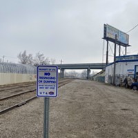 A UTA "No Trespassing" sign guards a dormant stretch of railroad in the Ballpark Neighborhood where the Trax Red Line would run under a preferred service extension plan.